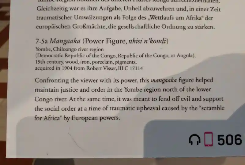 Mangaaka, Nkisi wooden figure, powerful, forward-leaning stance, hands on hips, created to enforce judicial and social order
